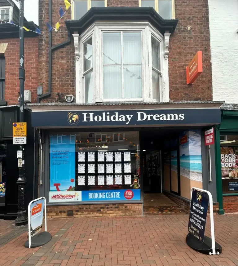 Holiday Dreams travel agency storefront with holiday booking displays